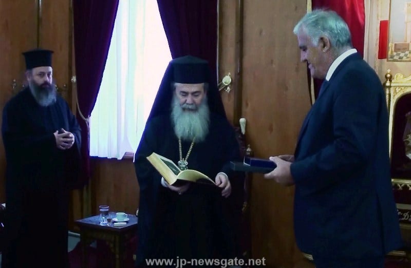 His Beatitude offers Mr Tsokas the book on the Church of Jerusalem